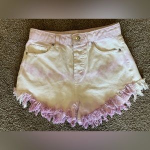 Purple and white tie-dyed denim shorts with raw hem